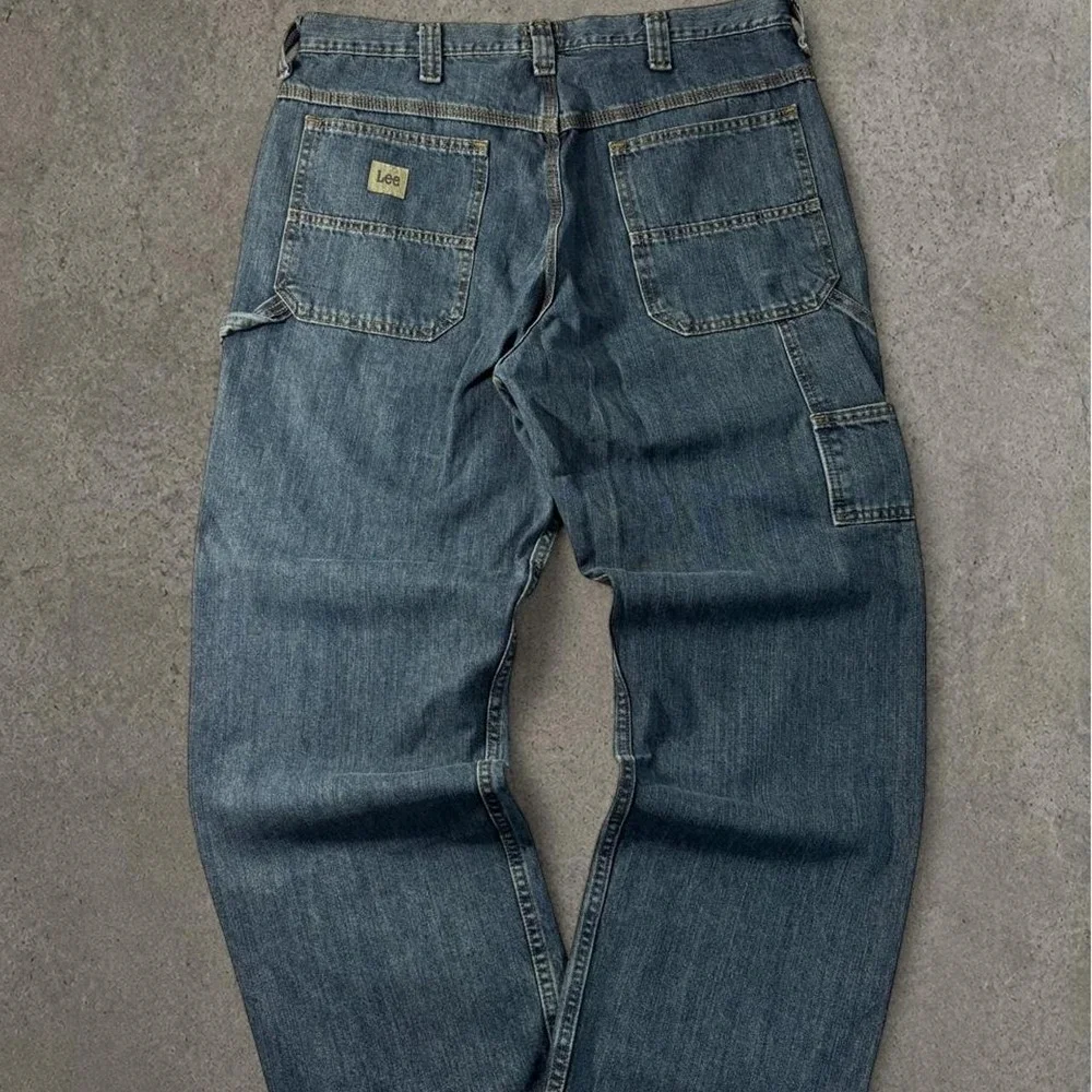 2000s baggy lee carpenter dark washed workwear denim